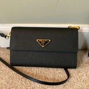 Authentic Prada Saffiano and leather wallet with shoulder strap in black